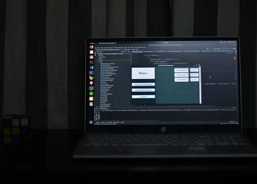 black hp laptop computer turned on displaying desktop