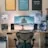 a desk with a computer and speakers on it