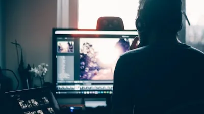 person editing photo on computer