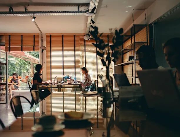 group of people sitting while using laptop computer