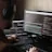 a man sitting at a computer with headphones on
